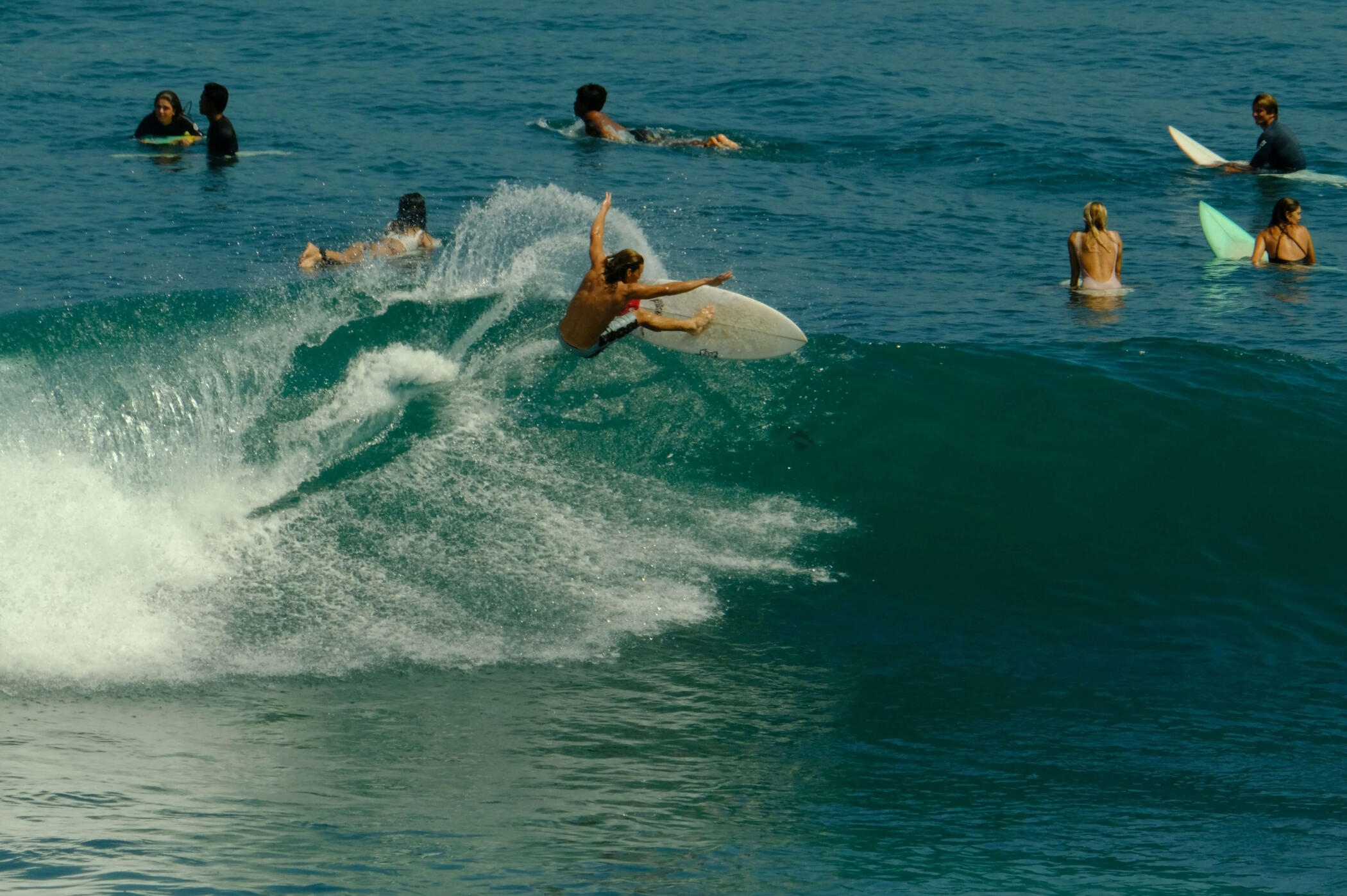 Swell Circle Surfers at the beach with boards, friendly, relaxed energy